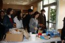 Students prepare sandwiches for their ride home.