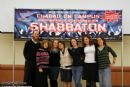 A group of students from Queens College pose for a picture.